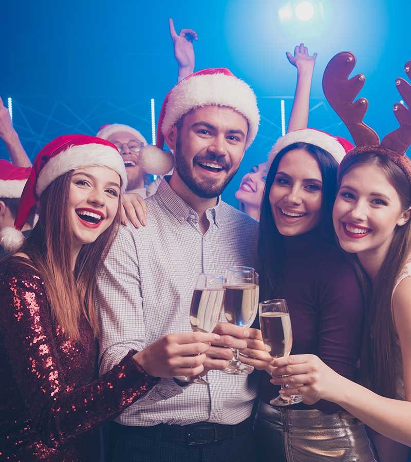 group of coworkers having fun during a holiday corporate event group of coworkers having fun during a holiday corporate event<br />