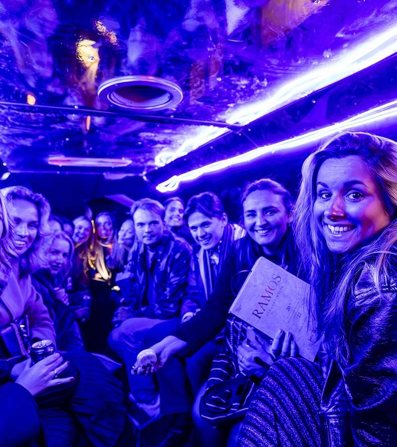 group party aboard a party bus under neon lights group party aboard a party bus under neon lights<br />